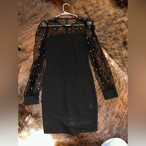 Sheer sleeved with pearls, black dress.
